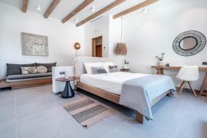A bed or beds in a room at Luxury Villa Terra Promessa - Paxos