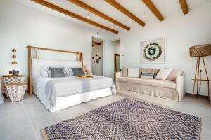 A bed or beds in a room at Luxury Villa Terra Promessa - Paxos
