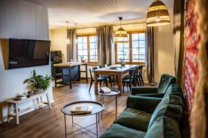 a living room with a couch and a table at Willa Leluja in Zakopane