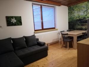 a living room with a couch and a table at Feriendomizil Wachau in Habruck