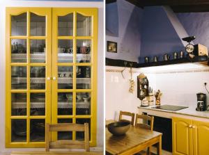 cocina con puertas amarillas y mesa en la cocina en Casa de La Gañanía, en Los Realejos