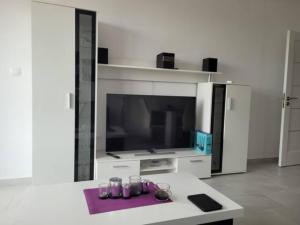 A television and/or entertainment center at Bayview B32 - Burgas Beach Resort