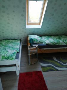 a bedroom with two bunk beds and a window at Am Kleinheider Weg in Großheide