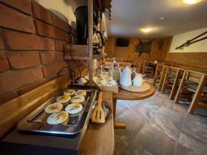 a kitchen with a tray of donuts on a table at Pension Polonia in Vrchlabí
