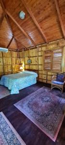 Voodi või voodid majutusasutuse Ciudad Perdida EcoLodge toas