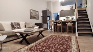 a living room with a couch and a table at Key for Kiato House-Modern Loft design in Kiaton