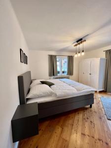 En eller flere senge i et værelse på Haus Stille Nacht Wagrain