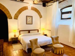 Ένα ή περισσότερα κρεβάτια σε δωμάτιο στο Agriturismo Germogli I Tenuta di Fassia