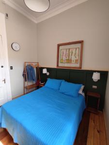 Postel nebo postele na pokoji v ubytování Hostal Dinamarca