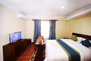 Letto o letti in una camera di Karma Hotel Nepal