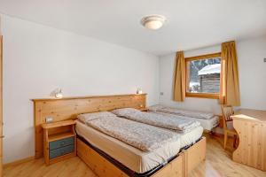 A bed or beds in a room at Appartamento Vago