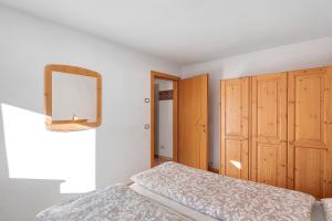 A bed or beds in a room at Appartamento Vago