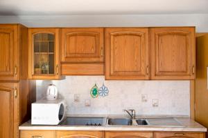 A kitchen or kitchenette at Appartamento Vago