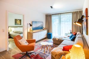Televízia a/alebo spoločenská miestnosť v ubytovaní Haus Bergblick by AlpenTravel