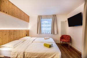 Letto o letti in una camera di Chalet Osmar Suite 1