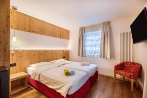 Letto o letti in una camera di Chalet Osmar Suite 1