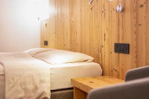 Ένα ή περισσότερα κρεβάτια σε δωμάτιο στο Chalet Osmar Suite 2