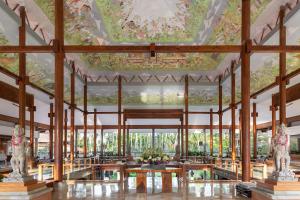 a rendering of the lobby of a resort with a painting on the ceiling at Melia Bali in Nusa Dua