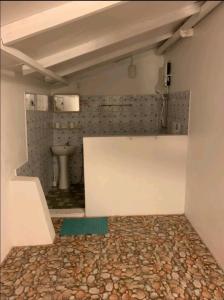 a bathroom with a toilet and a sink at Royal Beach Dhigurah in Dhigurah