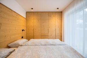 Posteľ alebo postele v izbe v ubytovaní Apartments Armeri Black Dolomites