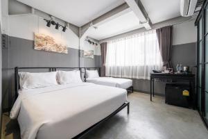 Een bed of bedden in een kamer bij Talakkia Boutique Hotel