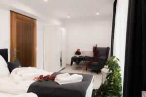 Posteľ alebo postele v izbe v ubytovaní Royal Apartments & Spa Zakopane-Cyrhla