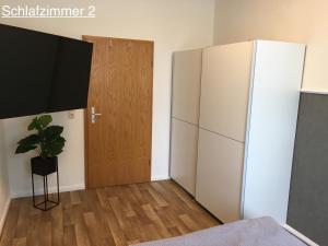 Cama o camas de una habitación en Ferienwohnung RIENA