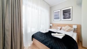 Posteľ alebo postele v izbe v ubytovaní Apartamenty Sun & Snow Resort Karkonosze