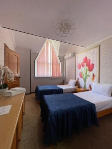 Кровать или кровати в номере Гостиница Медовая