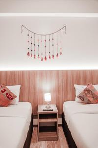 Cama ou camas em um quarto em Casa Matara Boutique
