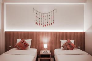Cama ou camas em um quarto em Casa Matara Boutique