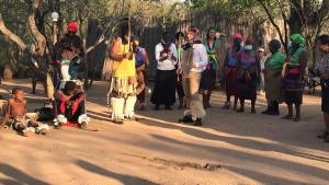 a group of people standing around in the dirt at Mzsingitana Tented Camp in Hoedspruit