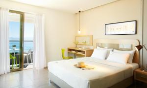 Posteľ alebo postele v izbe v ubytovaní Margarita Sea Side Hotel