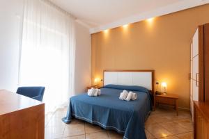 Postel nebo postele na pokoji v ubytování Hotel Aurora e del Benessere