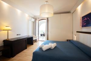 Postel nebo postele na pokoji v ubytování Hotel Aurora e del Benessere