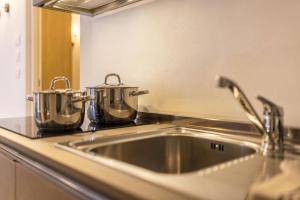 Kuchyňa alebo kuchynka v ubytovaní Apartment Ön Residence Bun Ste + 27 fotografií