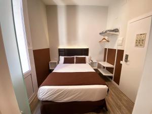 A bed or beds in a room at BCN Urbaness Hotels Bonavista