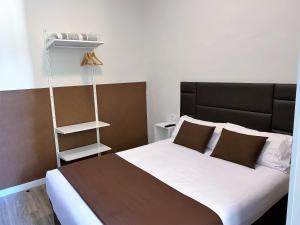 A bed or beds in a room at BCN Urbaness Hotels Bonavista