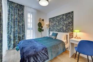 Posteľ alebo postele v izbe v ubytovaní Anchor Apartments JUNGLA + 1 fotografia