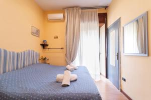 Posteľ alebo postele v izbe v ubytovaní Medina H. Napoli Centro, by ClaPa Group
