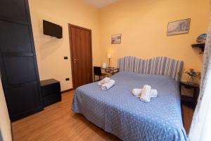 Posteľ alebo postele v izbe v ubytovaní Medina H. Napoli Centro, by ClaPa Group