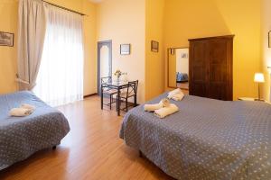 Posteľ alebo postele v izbe v ubytovaní Medina H. Napoli Centro, by ClaPa Group