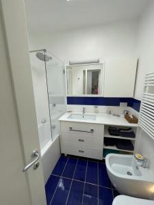a bathroom with a sink and a shower and a toilet at Le Rocce da Tragara, Tragara essential in Capri