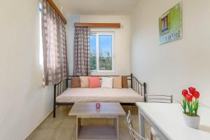 A bed or beds in a room at Litsas Studios