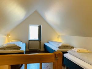 Postel nebo postele na pokoji v ubytování Ribe Byferie Resort + 37 fotografií