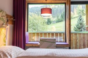 Postel nebo postele na pokoji v ubytování Explorer Hotel Neuschwanstein + 37 fotografií