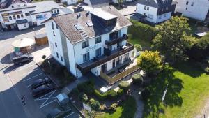 an overhead view of a large white house at Smart Resorts Haus Azur Ferienwohnung 808 in Winterberg