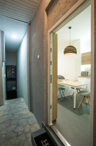 an open door to a dining room with a table at Studio 10 in Belgrade