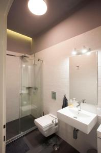 a bathroom with a sink and a shower and a toilet at Studio 10 in Belgrade