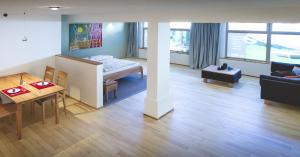 a living room with a table and a dining room at Appartement E3 in Wasserburg am Inn